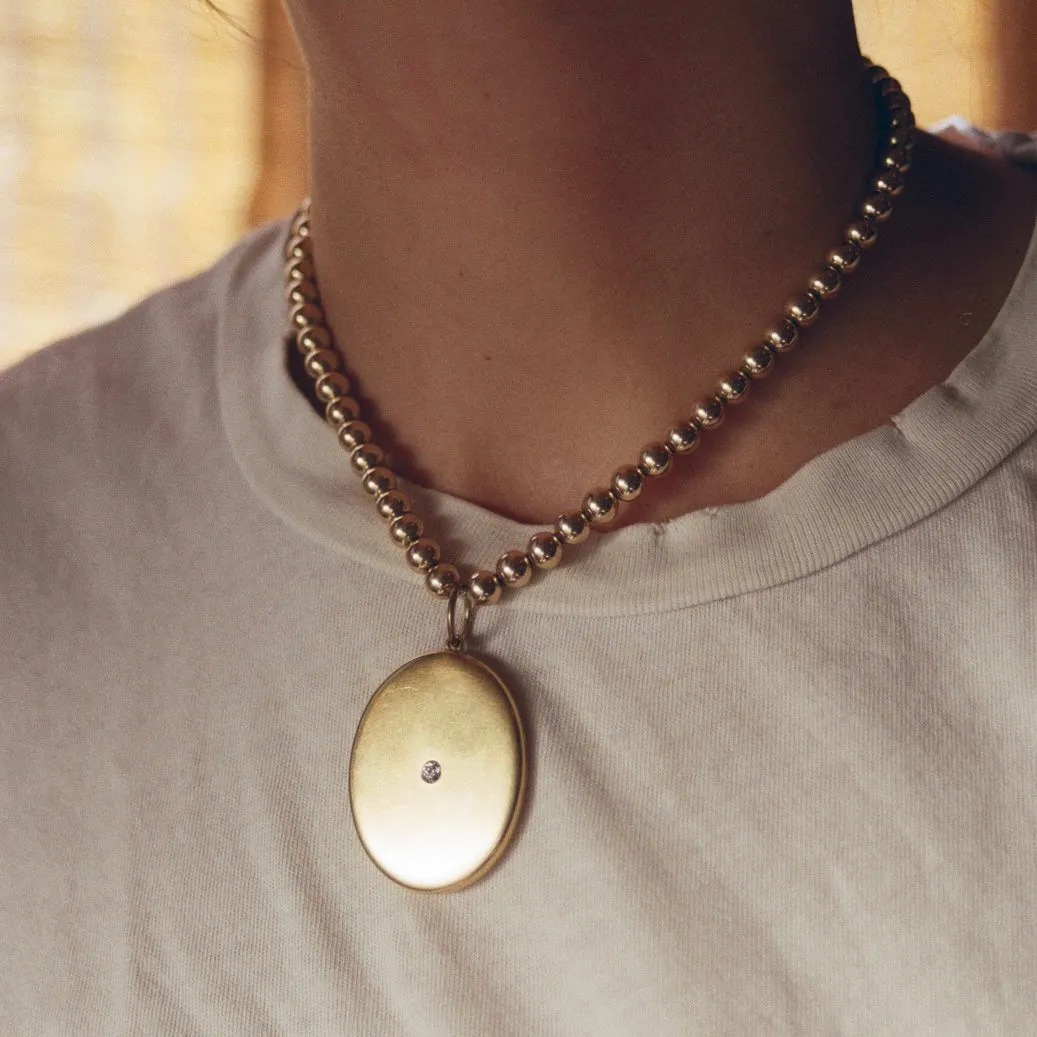 1910 14k Gold Diamond Locket
