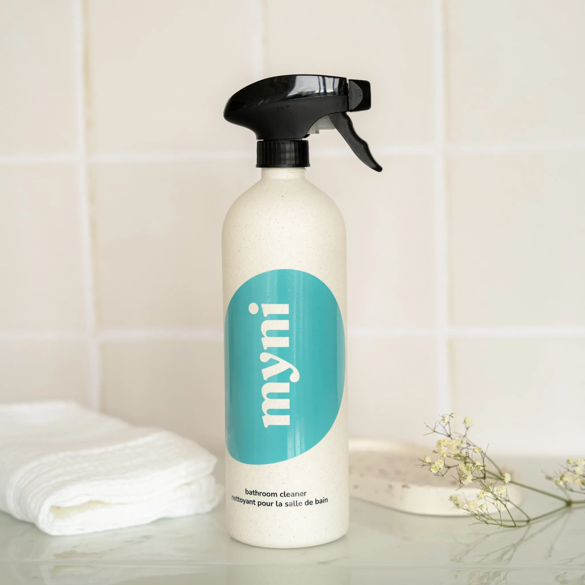 Bathroom cleaner bottle in wheat straw