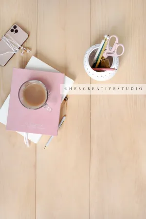 Coffee & Calculator on Light Wood Floor. Styled Stock Image.