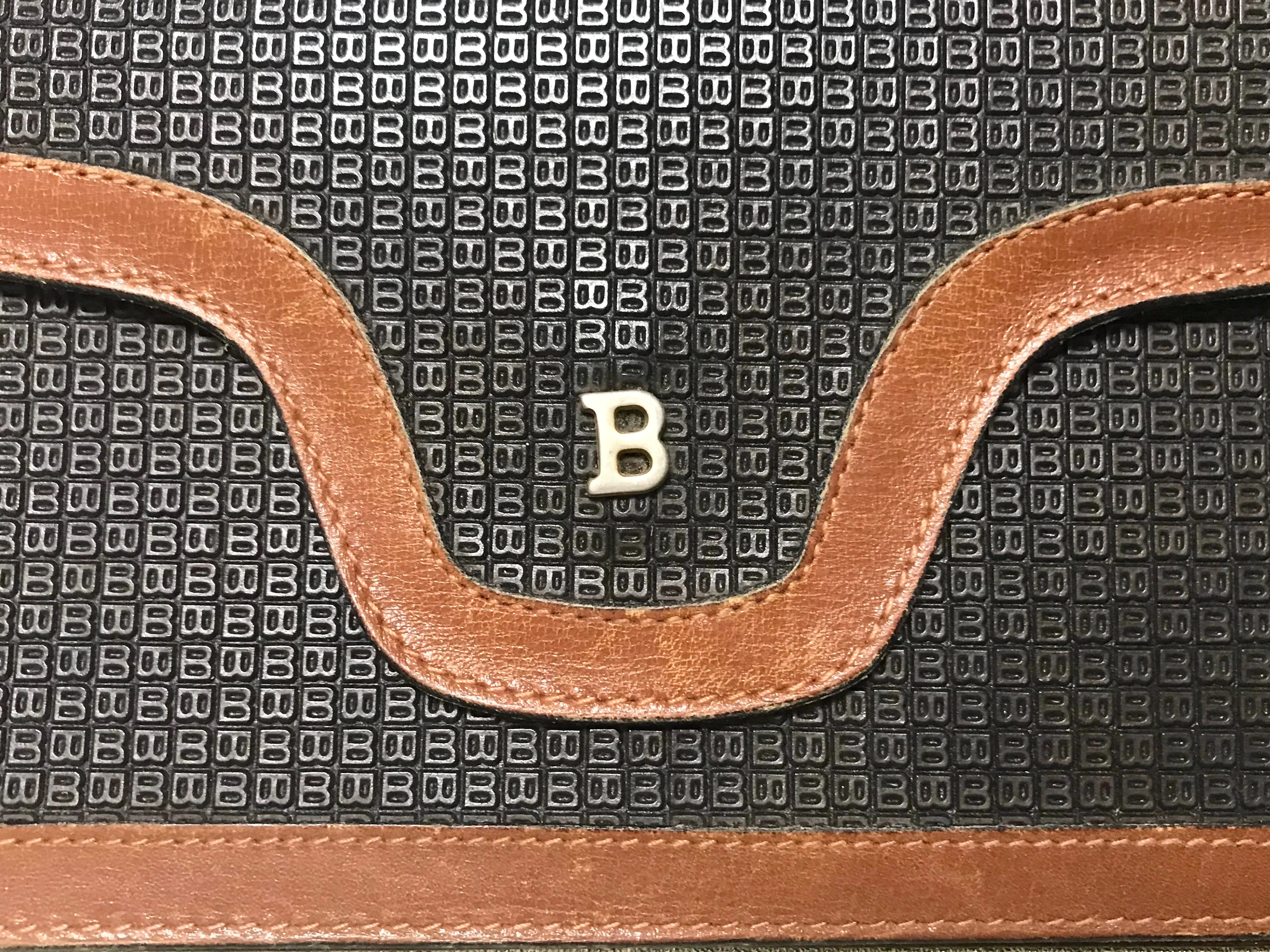 Vintage Bally black and brown wallet with B logo motif. Classic purse for unisex use. 060909r1